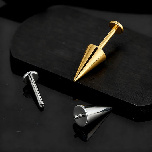 Close-up of gold spike labret and silver internally threaded cone and post