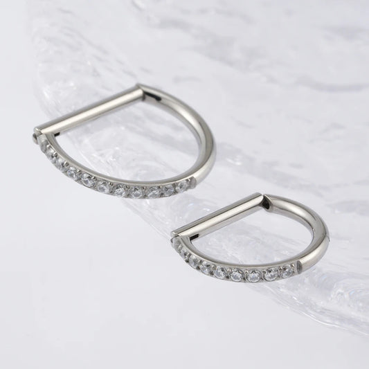 Titanium Silver CZ D-shaped clicker rings shown from the side