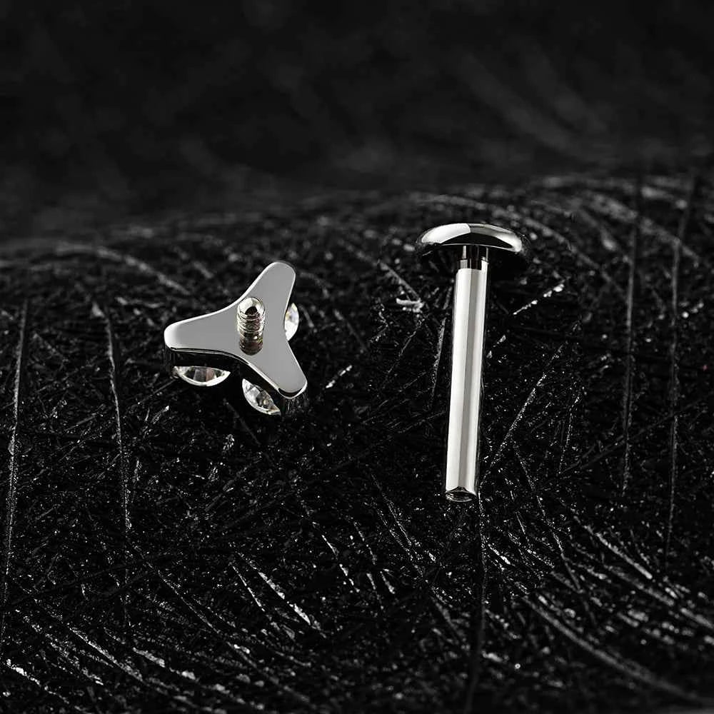 Trinity CZ top shown separately beside its silver-tone flat back post on dark stone.