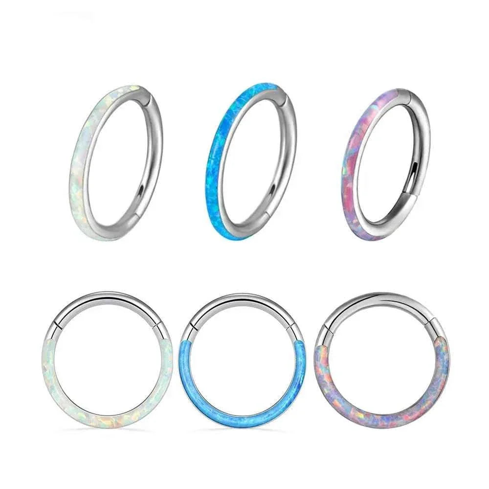 Titanium opal-inlay clicker rings shown in several colors