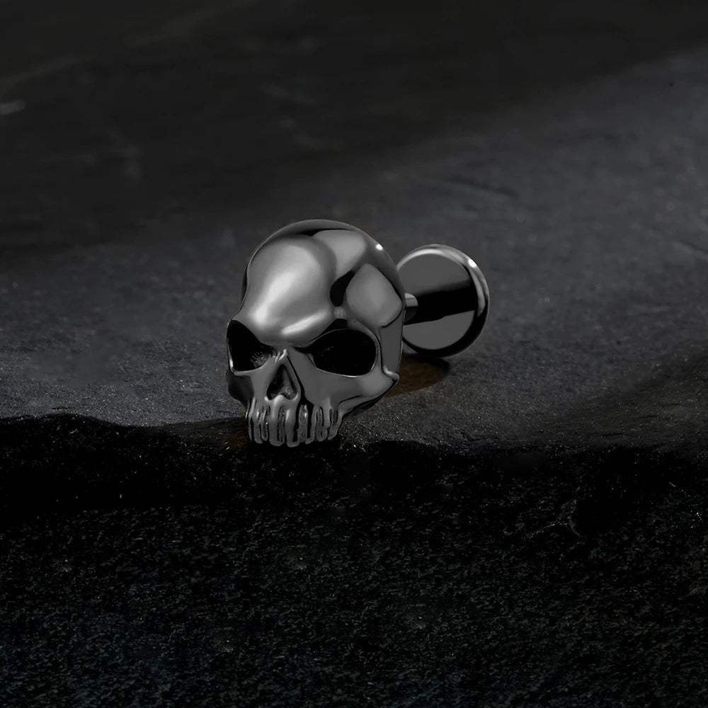 Black titanium skull 16G flat back labret stud close-up