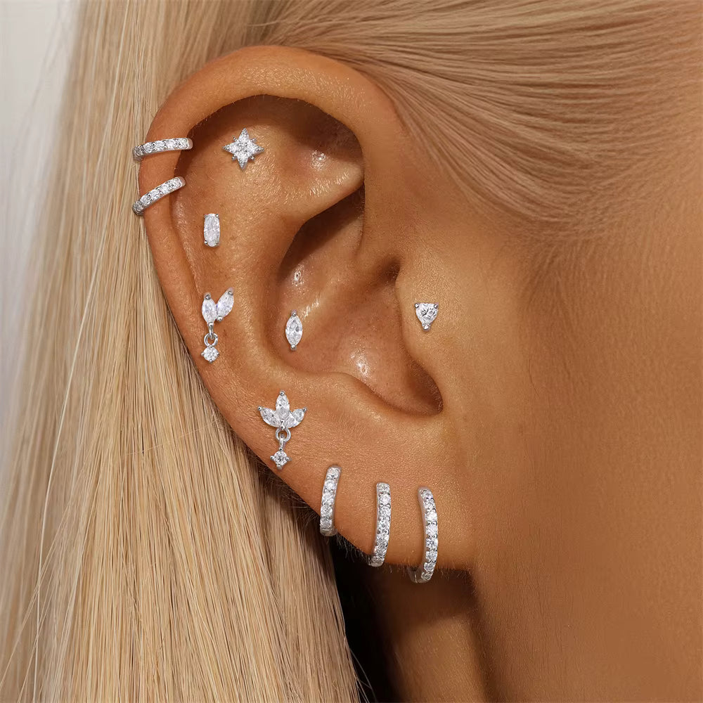 Ear with multiple minimalist piercing jewelry