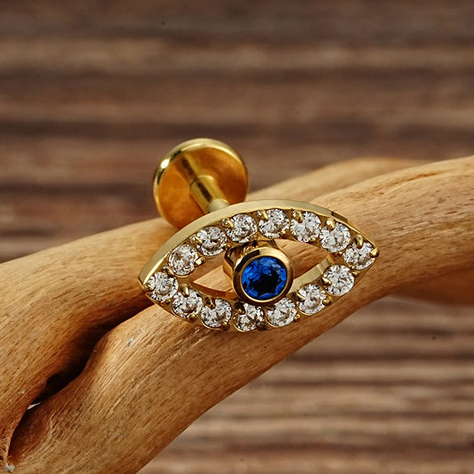 Gold titanium evil eye flat back stud with blue center and clear CZ halo