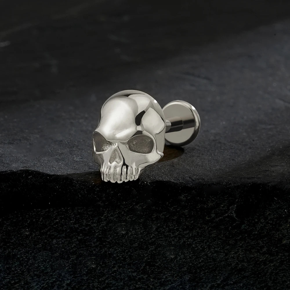 Silver titanium skull 16G flat back labret stud close-up