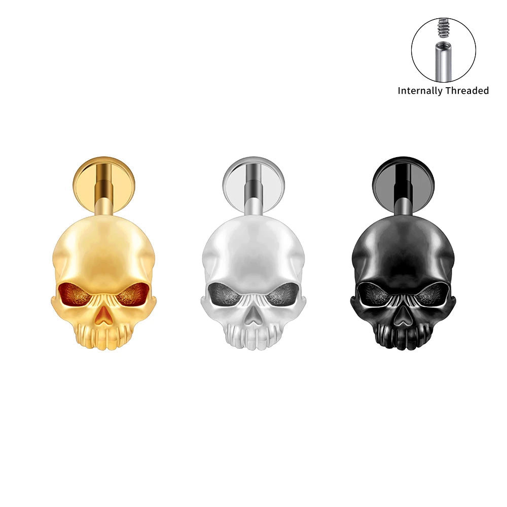 Front and back views of gold, silver and black titanium skull flat back labrets