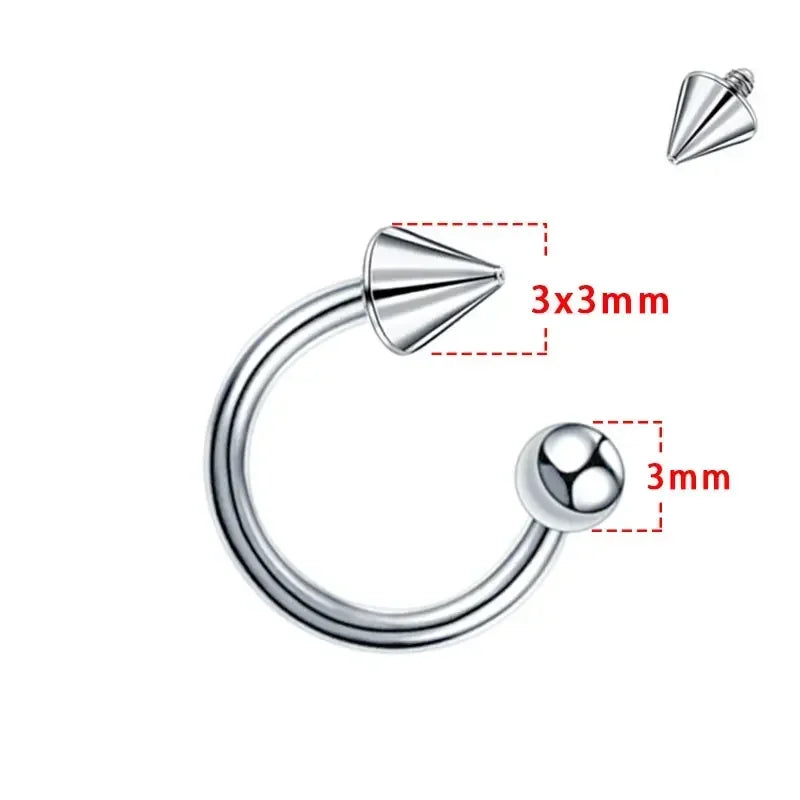 Silver-tone titanium horseshoe septum ring with one spike and one ball end