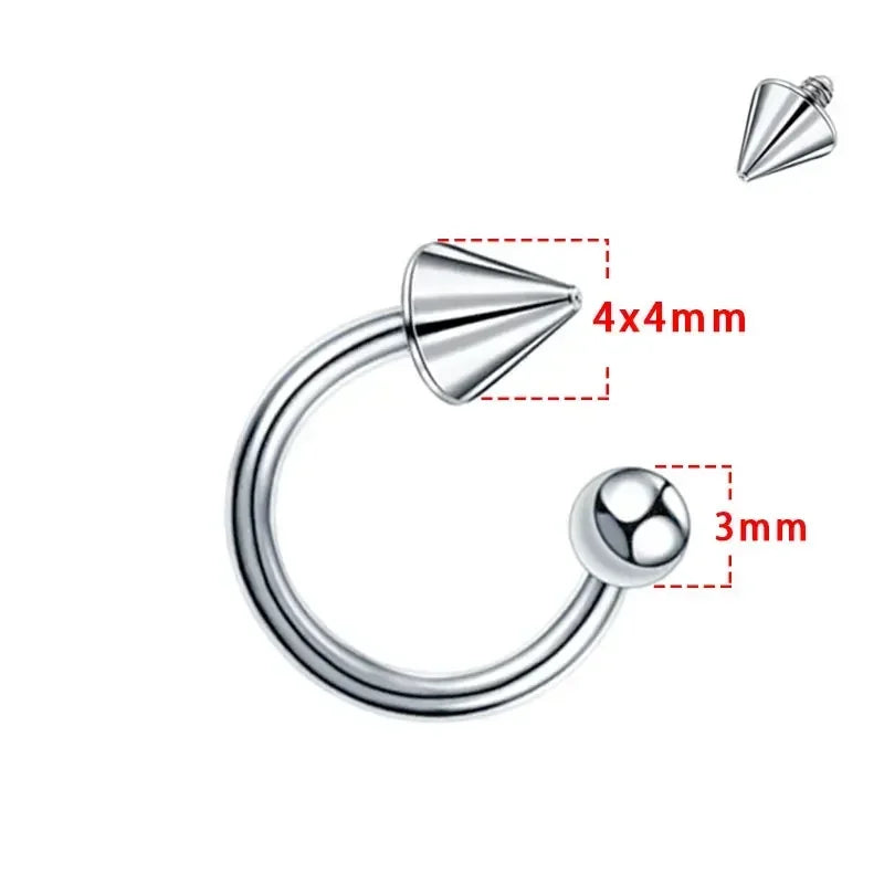 Silver-tone titanium horseshoe septum ring with one spike and one ball end